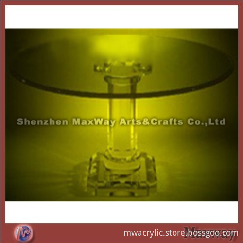 Luminous clear round lucite dining table
